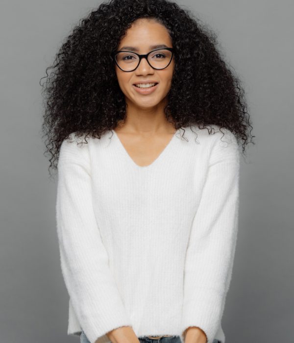 satisfied-african-american-woman-keeps-hands-toget-D5NXSJP.jpg